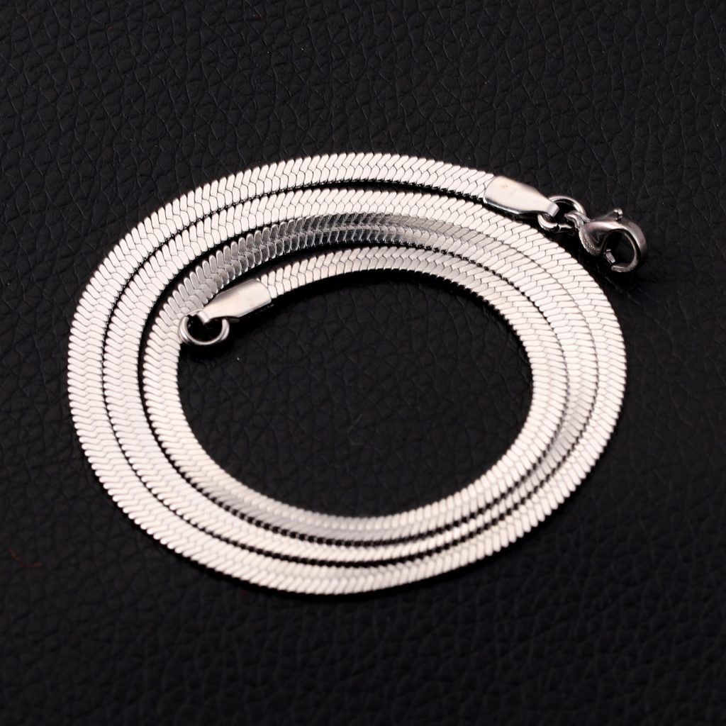 Thin, gold-colored flat snake chain necklace made of stainless steel and titanium steel.